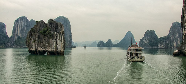 The picturesque and biodiverse limestone karsts and caves of Vietnam's Ha Long Bay have made it a World Heritage site. Photo by Bob DeGraff, taken on 21 February 2015. Licensed under Creative Commons Attribution-NonCommercial-NoDerivs 2.0 Generic.